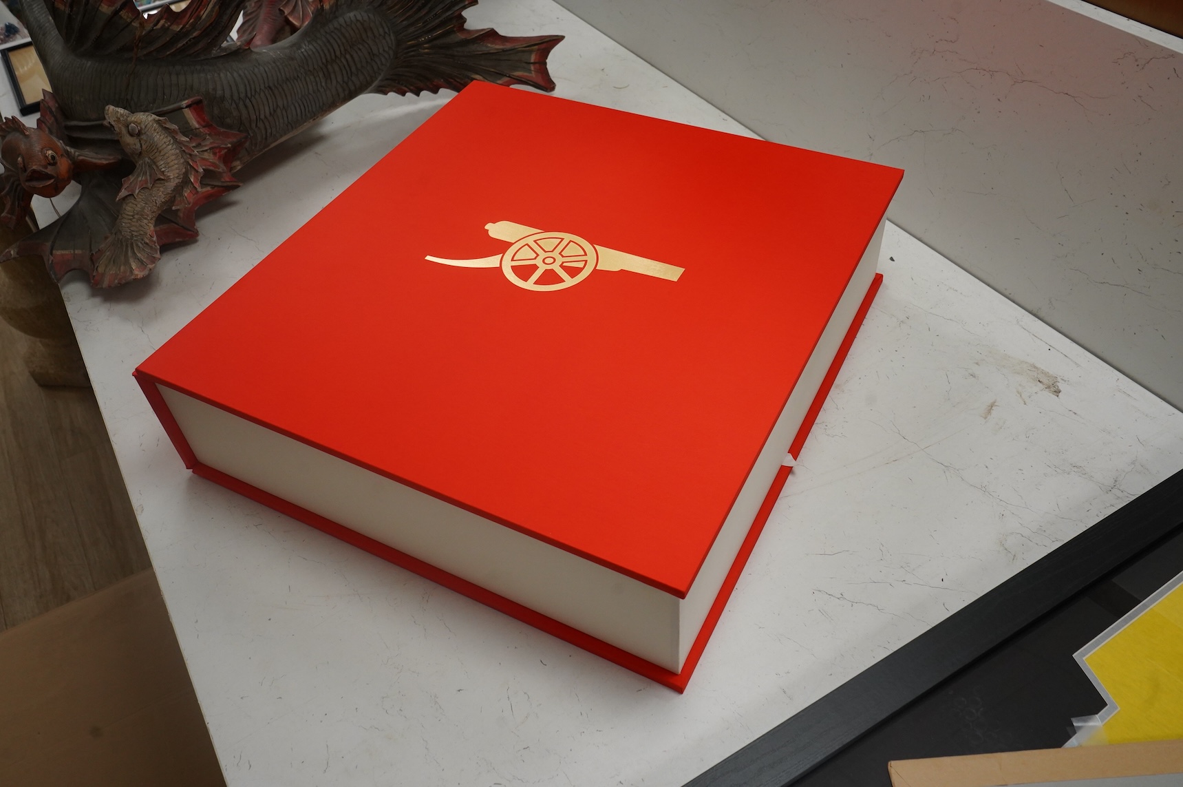 An Arsenal Opus, Icons Edition #47 in a series of 500, signed by Arsene Wenger, Tony Adams, Patrick Vieira, Dennis Bergkamp, Charlie George, Bob Wilson, Frank Mclintock, Thierry Henry, George Graham, Liam Brady, David Se